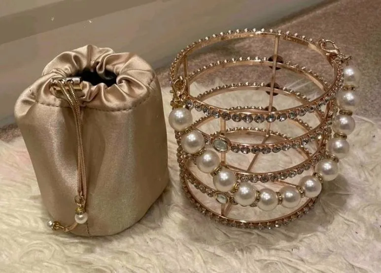 Premium faux pearl beaded clutch bag.